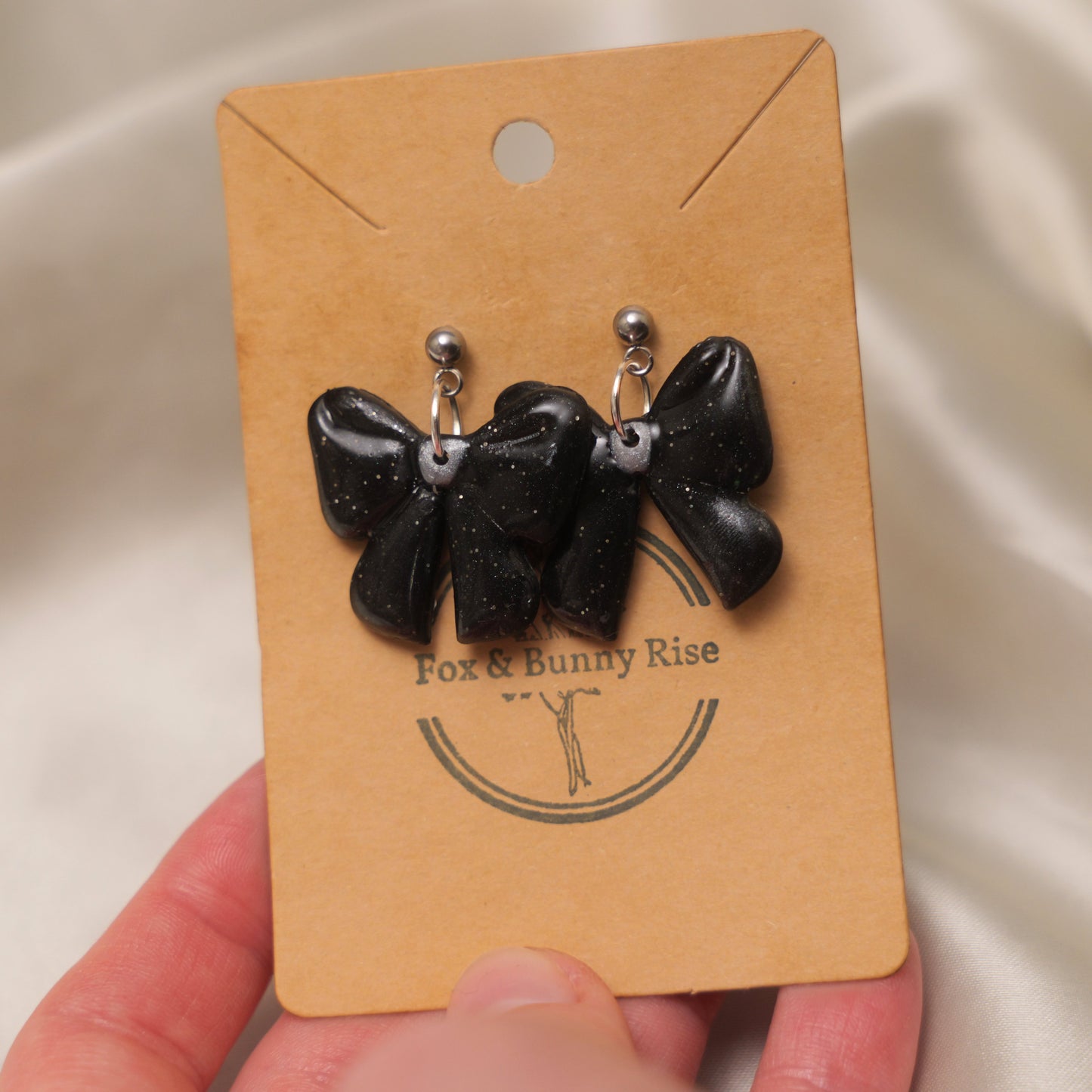 Glossy Glittery Black Bow Dangle Earrings